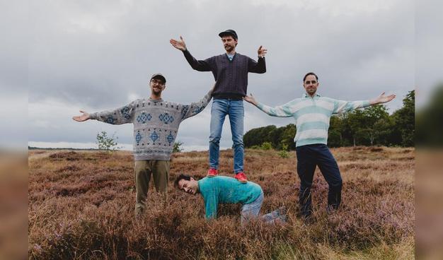 Picture of the band members of the band Cheeses of Mexico, standing in a field.