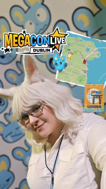 A women stands Infront of a display reading "Megacon Live". She is wearing a short white curled wig with a straight fringe and white bunny ears. She has a white shirt on and is wearing a creators badge on a lanyard. Next to her head is an image of a route on a map from Scotland to Dublin Ireland.