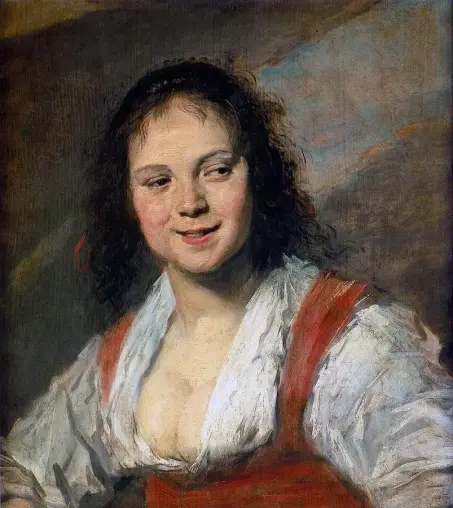 Bust of a smiling girl with a long neckline on her dress that partially shows her breasts.