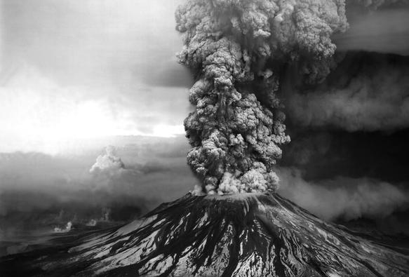 photo - An ash plume billows from the crater atop Mount St. Helens hours after its eruption began on May 18th, 1980, in Washington State. The column of ash and gas reached 15 miles into the atmosphere, depositing ash across a dozen states