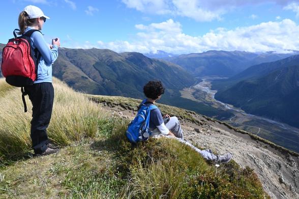 A photo of Michelle and Sam, to members of our class, up on Mount Faust above the tree line looking south down onto the Boyle Outdoor Education Centre. We were collecting seed heads of daisies to compare the seed predation rates between native and exotic plants.