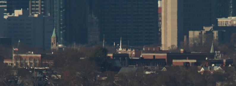 The Jeremiah E Burke High School, 60 Washington St, Dorchester MA (6.37 miles) with five churches, photographed from Buck Hill.
