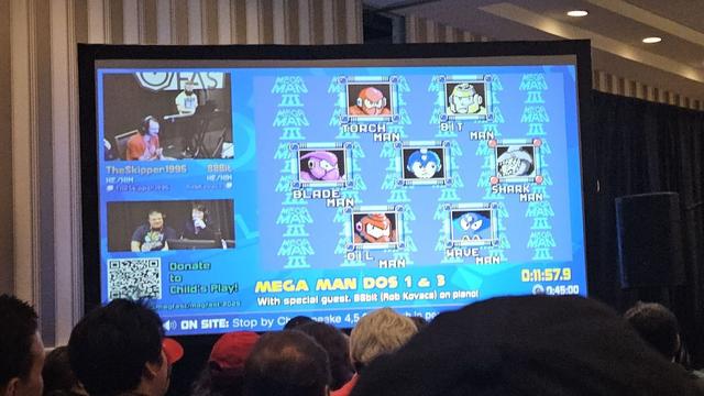 Close up of a screen showing the six bosses of Mega Man DOS 3 within a Twitch stream.