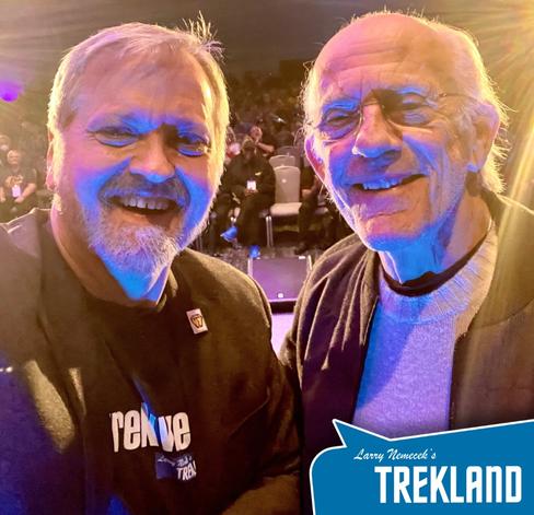 "Dr. Trek" Larry Nemecek at left, Christopher Lloyd at right, onstage with audience in the background after their appearance together at STSF