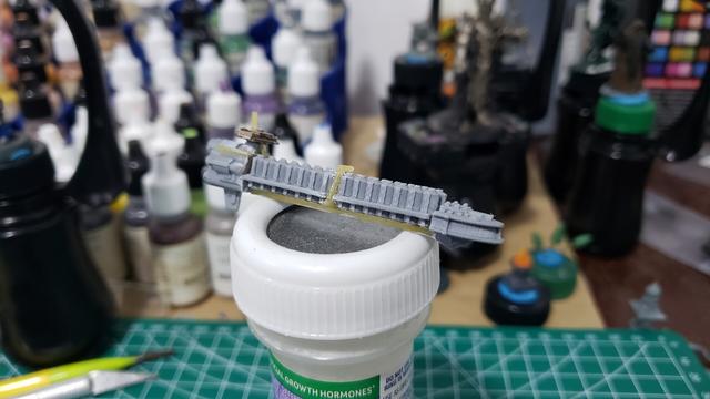 Grey plastic BFG cargo ship with 2 cargo modules. Yellow pasta runs along the bottom of the of ship to provide some extra support, and pasta bracing helps disguise the print flaws in the middle of the ship