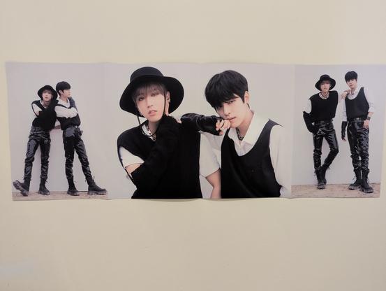 Poster featuring three views of Han and Seungmin from Stray Kids, leaning on each other and (mostly) looking at the camera