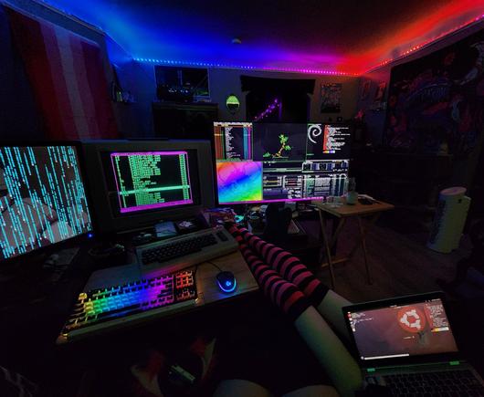 Couple of queer cuties with some terminals and a c64 being nerds on a Thursday night~ :3