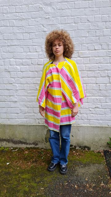 A person wearing a kimono with horizontal stripes to bypass cctv face recognition.