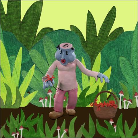 A blue clay character in a nature scene happily picks flowers and drops them in a basket