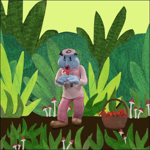 A blue clay character in a nature scene happily picks flowers and drops them in a basket