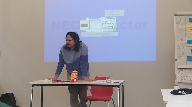 Clement stood at the front of the FreeCAD day room.