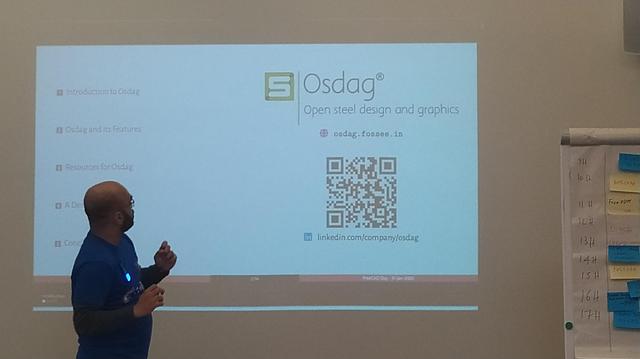 Ajinkya in front of a projection with Osdag contqct details.