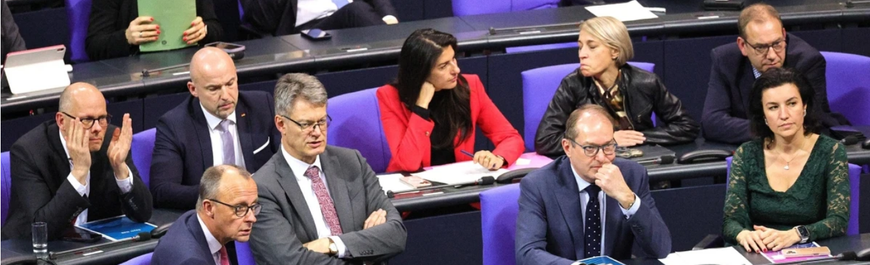 Merz and other CDU/CSU top politicians in the Bundestag, looking disappointed