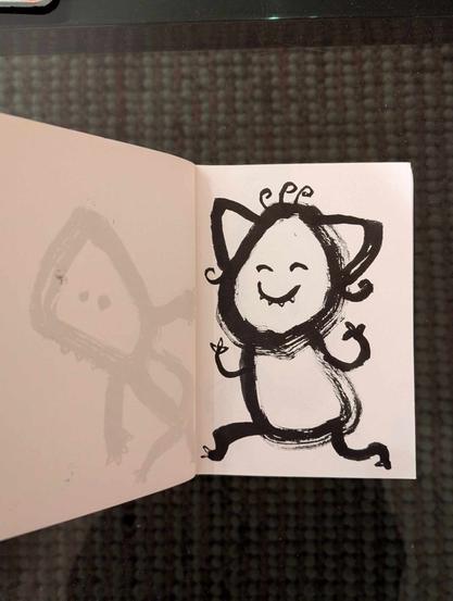 Petit dessin intuitif et enfantin au feutre noir.