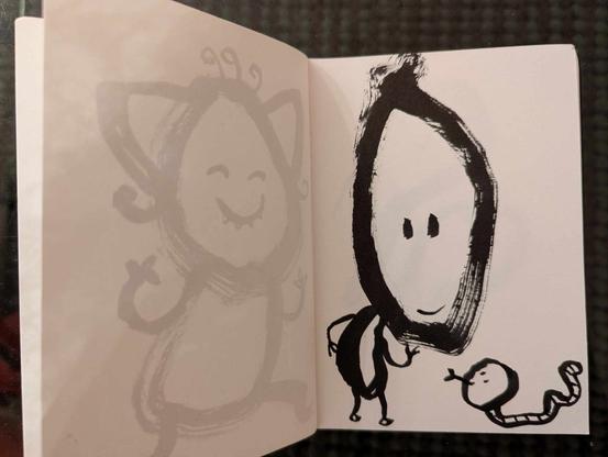 Petit dessin intuitif et enfantin au feutre noir.