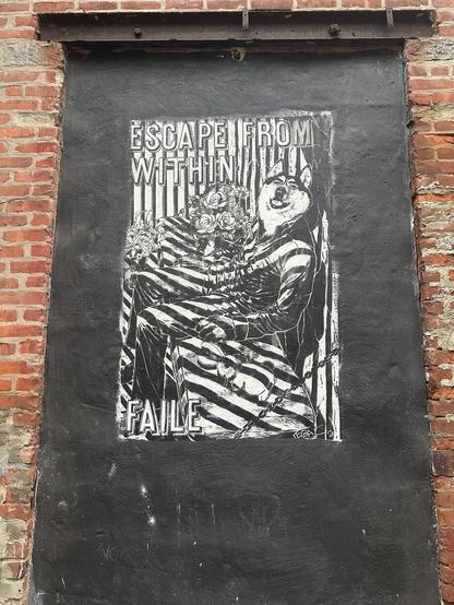 an intricate stencil on a black-painted panel in a red brick wall depicting a wolf in a leather jacket slouching on a bench with flowers, striped in sunlight. the top reads ESCAPE FROM WITHIN and the bottom left says FAILE