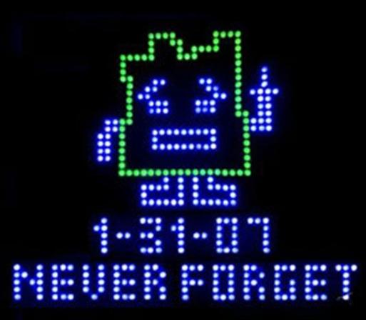 Illustration of a glowing LED sign portraying the character Ignignokt the Mooninite from "Aqua Teen Hunger Force" from the infamous Boston bomb scare incident, and the text "1-31-07 Never Forget"