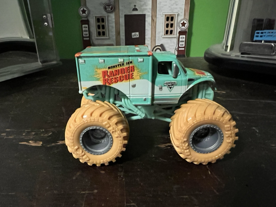 A teal colored monster truck toy called Ranger Rescue made by HotWheels.