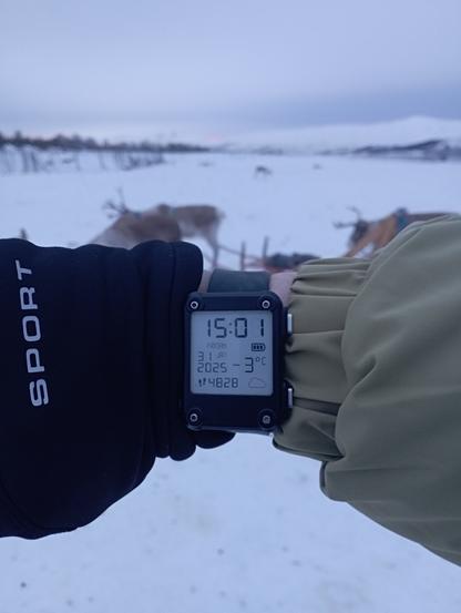 A Watchy with a case running Watchy GSR with the Watchy Classics (7-SEG) watchface showing the date, time, step count, battery, and weather (-3°C, Cloudy)
