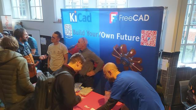A packed FreeCAD and KiCad booth.