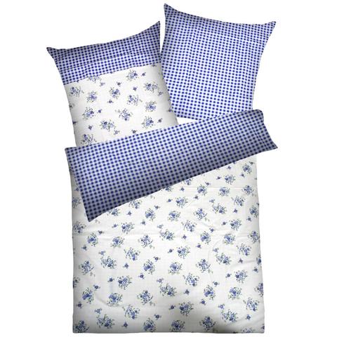 Bettwäsche Lina von Dyckhoff. Eine Seite weißer Frotte-Stoff mit blauem Blumenmuster, die andere Seite blau-karierter Biber-Stoff.