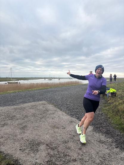 Emily approaching the camera and cornering and pointing backwards. (Trying to draw people’s attention to the murmurations).
