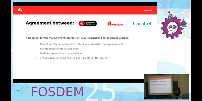 A slide and video still about the agreement between government and civil society that helped start an open source initiative