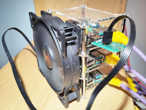 My Pi cluster being cooled using a 120mm PC case fan.
