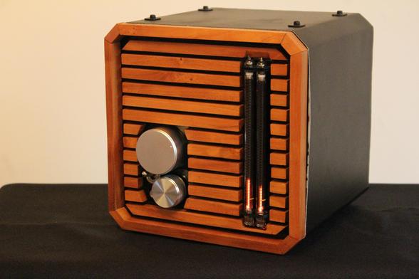 A photograph showcasing the amplifier described in the first message, facing left.