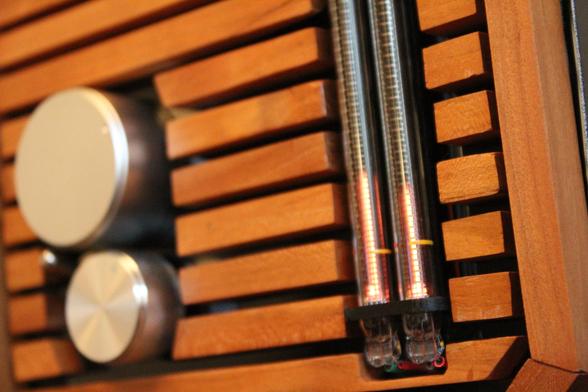 Close-up shot of the nixie amplifier from the right side, focusing on the IN-13 tubes, glowing from the bottom