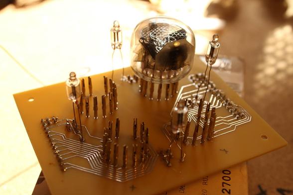 A daylight view of the nixie tubes mounting PCB, with only one tube installed out of the four