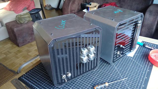 A front view of both boxes, with their aluminum sheet outside casing, not yet painted