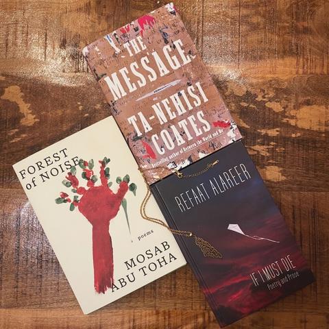 Three books and a golden Palestine necklaca on a wooden table. The books are Forest of Noice by Mosab Abu Toha, The Message by Ta-Nehisi Coates, and If I Must Die by Refaat Alareer.