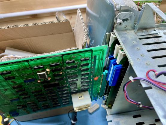 Overview of the CPT8520 floppy controller sticking out of the front of the machine on its new riser board I designed. Over the top the CRT is displaying 'please insert boot disk' :D