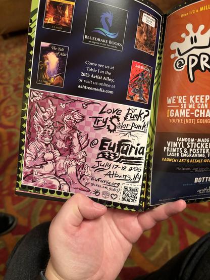 Eufuria's ad in the Anthro Expo con book. Punk and solarpunk versions of each convention's mascot, with "Love Punk? Try Solarpunk!" and Eufuria's info.