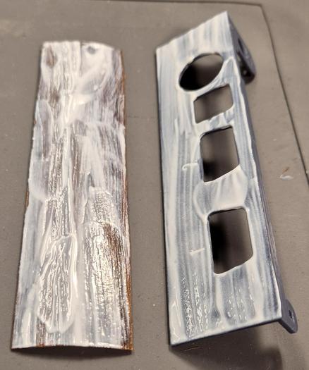 A 3d-printed C64 side bracket and a piece of veener, both covered in glue.