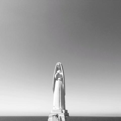 Black and white photo of a statue of Santa Monica