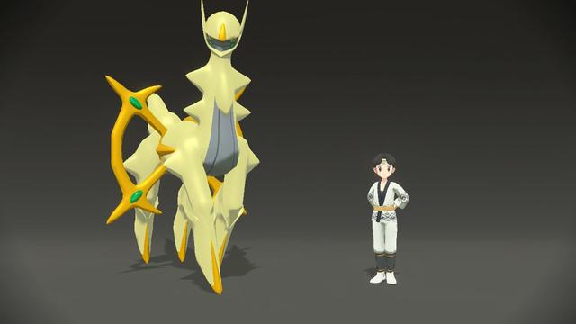 A photo of my character and Shiny Arceus, with a black background at the photo studio.