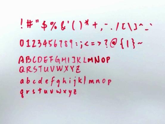My handwriting captured with a camera. It was written with a round-tip red marker.