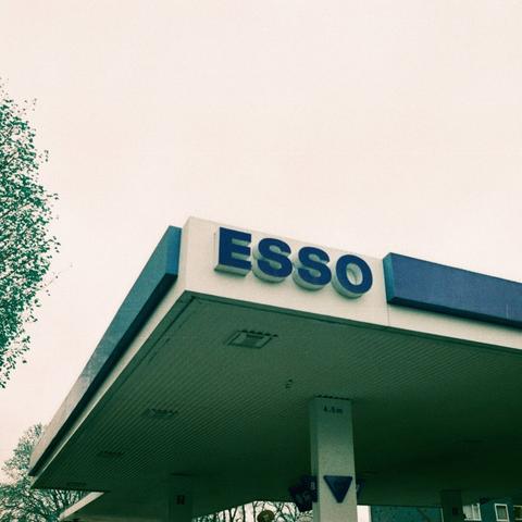 The corner of an esso garage forecourt cover, with the "esso" corner closest to the screen. Everything is shifted blue because of the lomochrome turquoise film