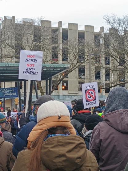 Protest signs that read:
Not HERE!
Not ANYWHERE! 

Resist Facism