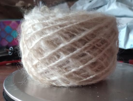 A cake of homespun wool yarn