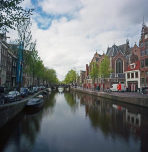A quiet canal in Amsterdam on a spring day.
