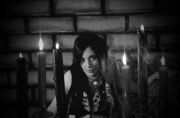 Goth marlena midnite in a Mausoleum with candles