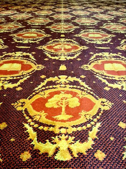 A rather garish 1970s carpet featuring the Glasgow Coat of Arms.