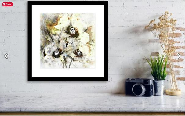 Cream and earth tone cosmos flowers in a black frame in a decor setting by artist and poet Sharon Cummings.  Haiku in post.