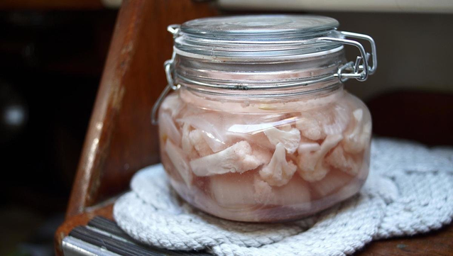 Pickled cauliflower and red onions in brine.