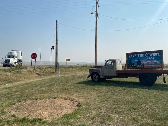 Title: Stop Grifting on Stolen Land

Alt Text: Photograph of two trucks near a highway intersection. One truck displays a "Save the Cowboy" sign, followed by "Stop the American Prairie Reserve." 

Photographer: Marshall Mayer aka @AuthenticPhoto

Date and Time: September 9, 2021 at 11:25 am

Location: intersection of MT 19 and US 191 near Roy, MT USA

License: CC BY-NC-ND 4.0

Caption: Signs with this message have heavily peppered central Montana in the last few years. A post office box in Roy is listed as the home of upom.org, the United Property Owners of Montana, producer of the sign. You can buy your own "Save the Cowboy" yard sign for only $35 by sending a check to UPOM in Roy. But the local ranchers don’t mind the grift. Cowboys were not asked.

Hashtags: #Repatriation #SaveTheCowboy #StolenLand #Astroturf #Grifters #CorporateAgriculture #PropertyOwners #Authentic #Photography

Source: https://take-note.com/note-takers/marshall--mayer/notes/stop-grifting-on-stolen-land/view