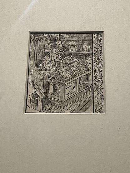 This an engraved drawing of a scholar at his desk with books and wearing prominent glasses. It’s titled “The Well Educated Fool” . It’s found in a 16th century book.