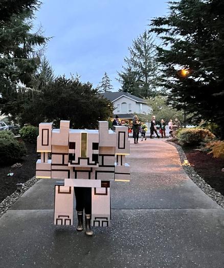 Gray and black with yellow trim Minecraft Monstrosity cardboard and duct tape costume.